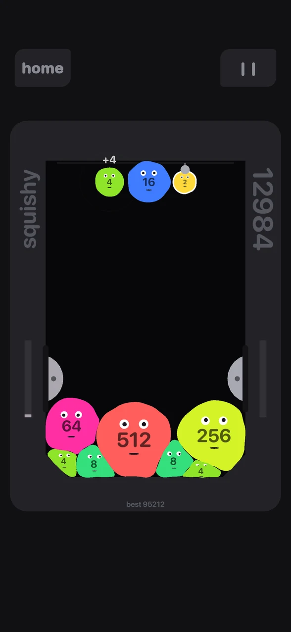 Squishy 2048 pile of merged blobs with faces on a phone